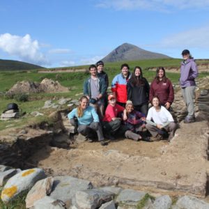 Students in excavated cottage site, Caraun Point, Achill Island
