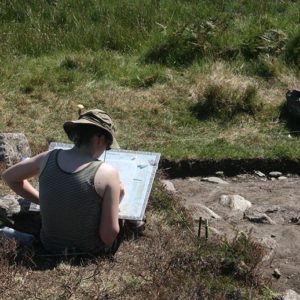 Archaeology student sketching at dig site, Achill Island
