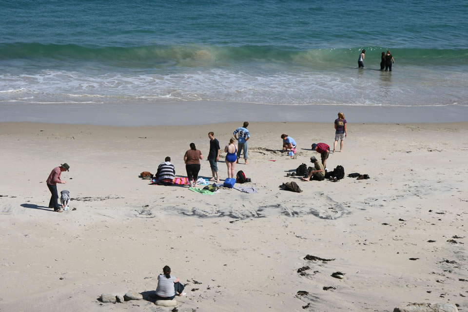 Students relaxing on the beach at Keem Bay